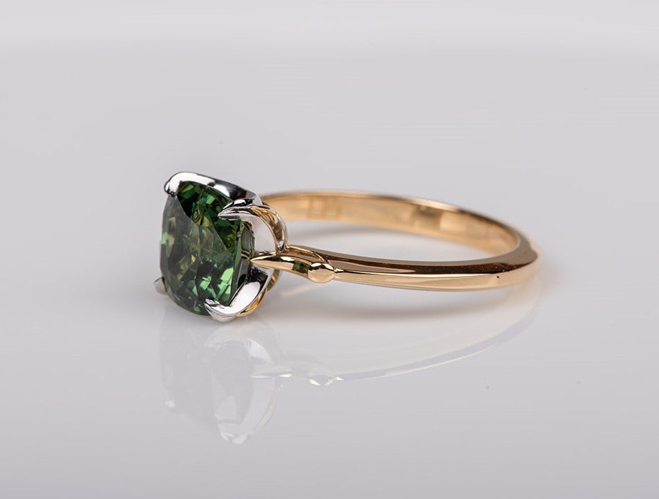 Single stone green sapphire ring