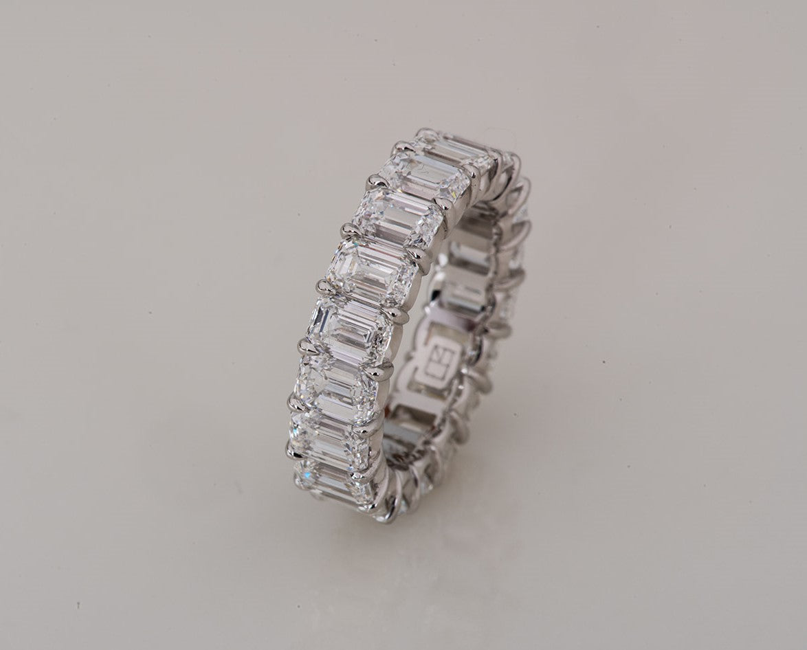 perfect emerald cut diamond infinity ring in platinum