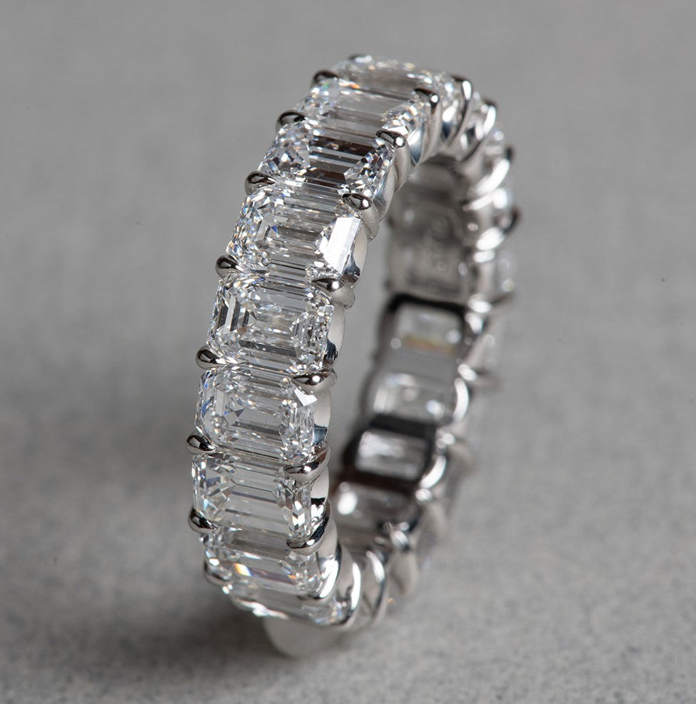 perfect emerald cut diamond infinity ring in platinum