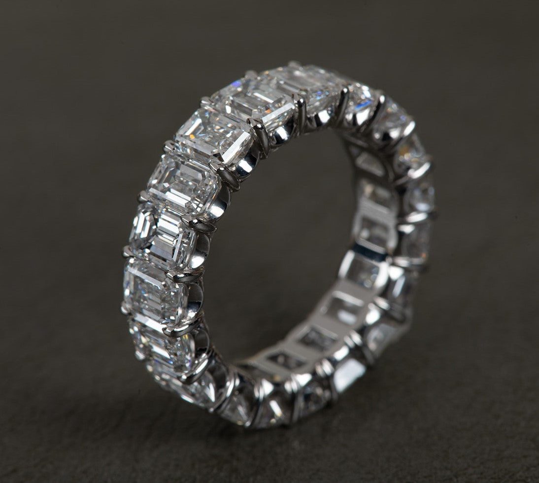 perfect emerald cut diamond infinity ring in platinum