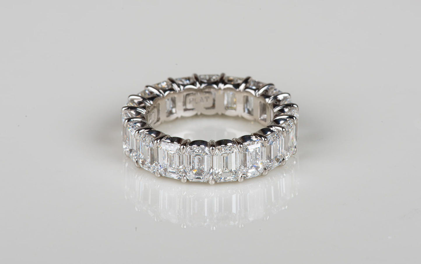 perfect emerald cut diamond infinity ring in platinum