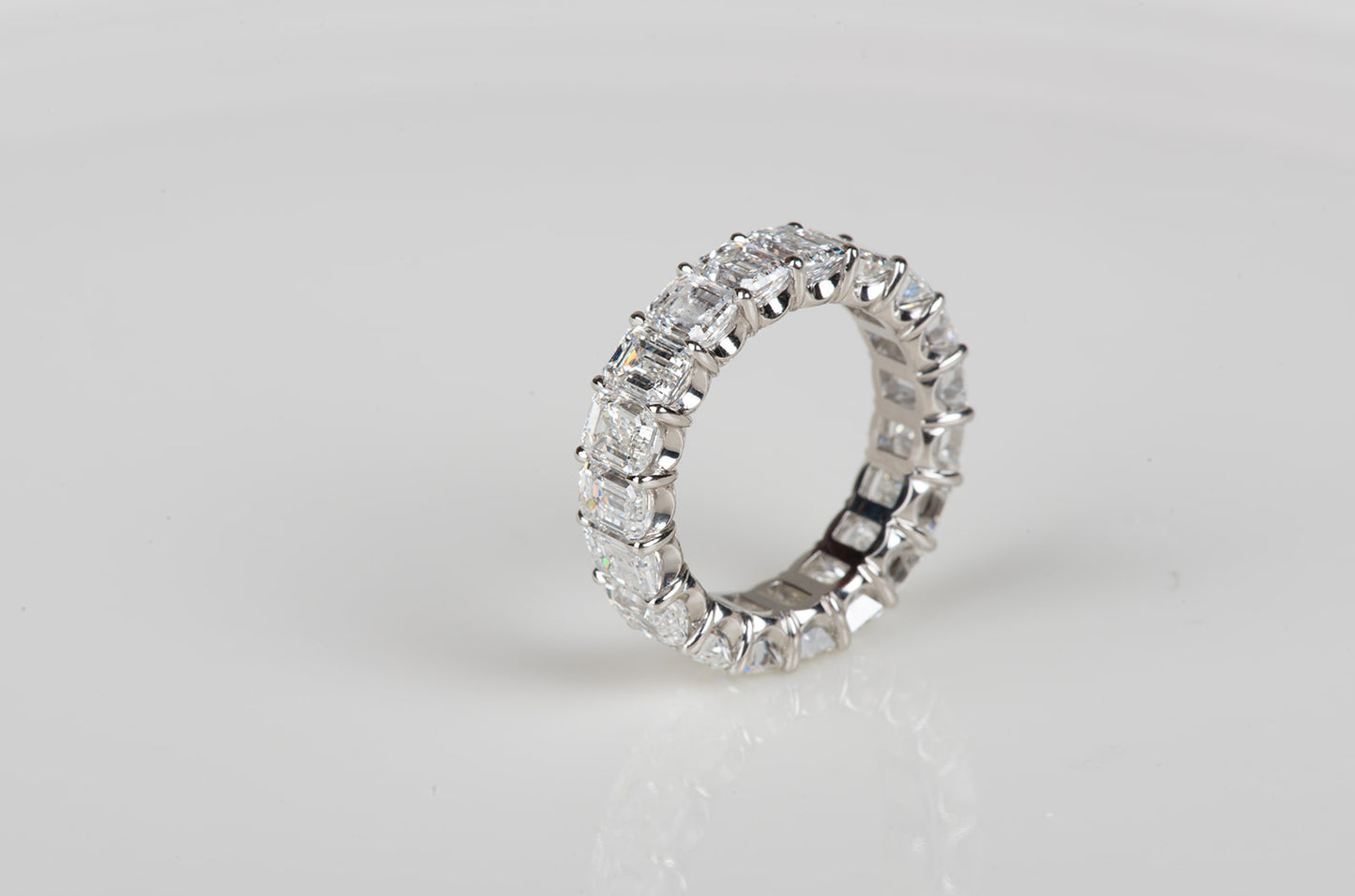 perfect emerald cut diamond infinity ring in platinum