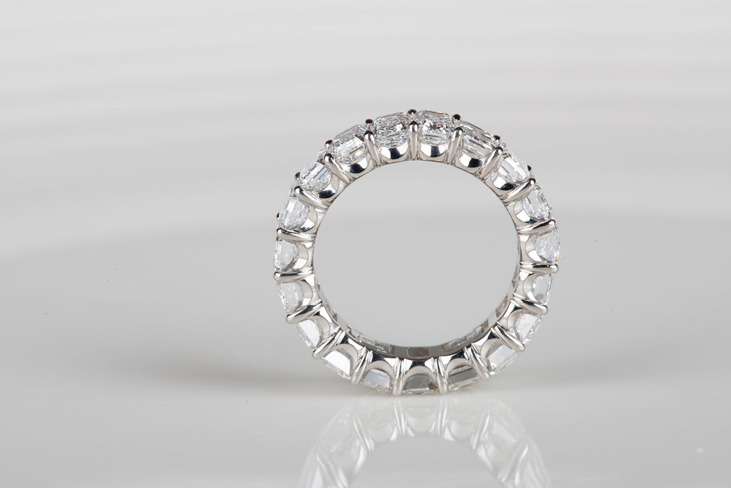 perfect emerald cut diamond infinity ring in platinum