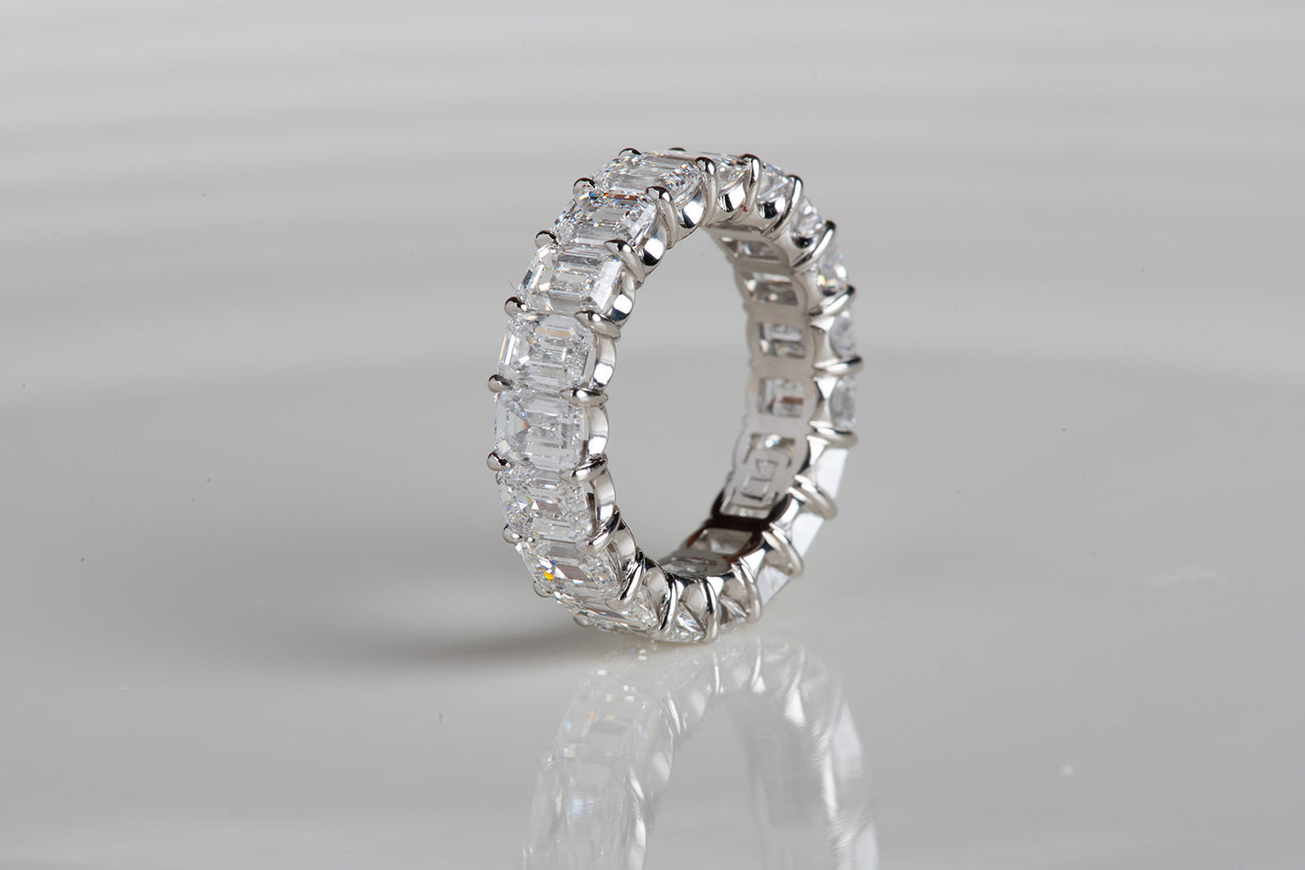 perfect emerald cut diamond infinity ring in platinum