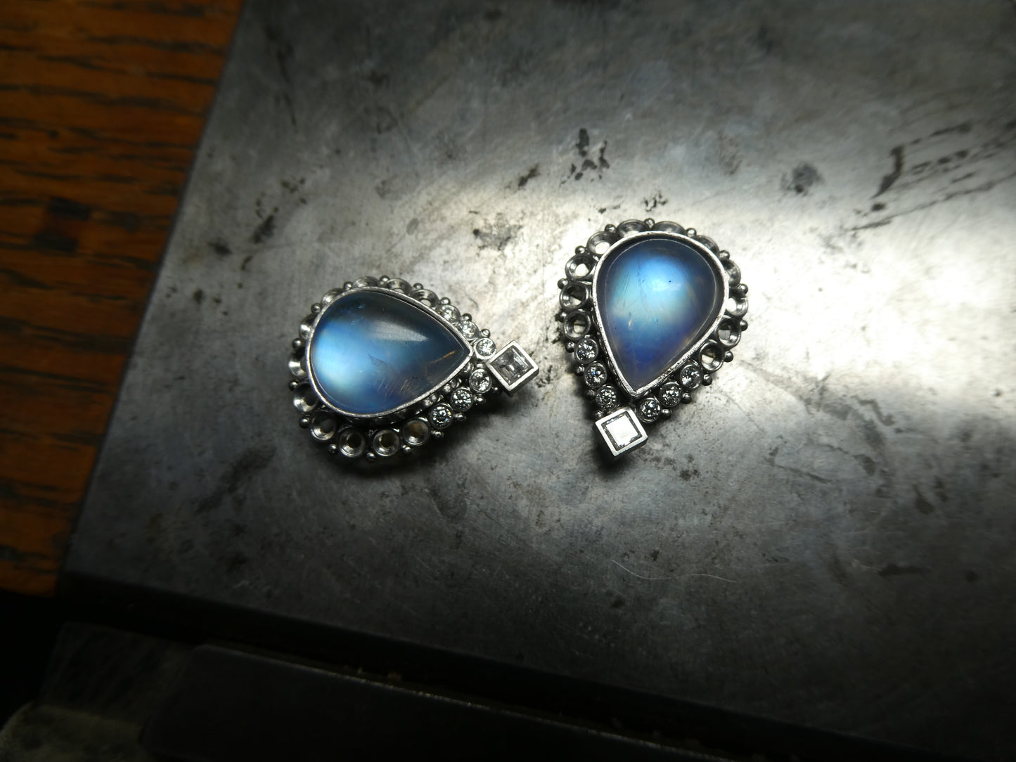 moonstone earrings set with diamonds in platinum