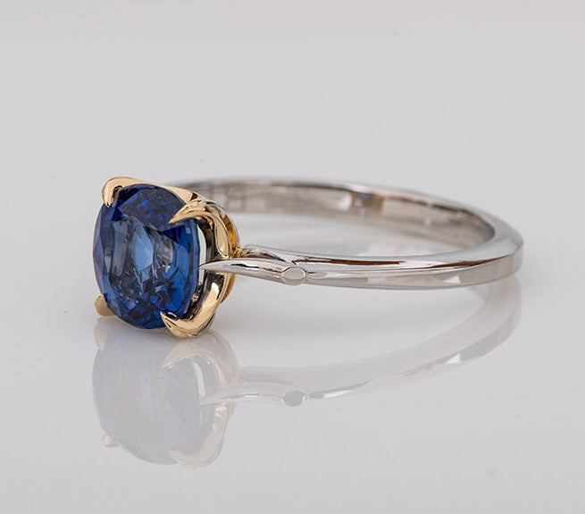 blue sapphire set in gold with platinum shank ring