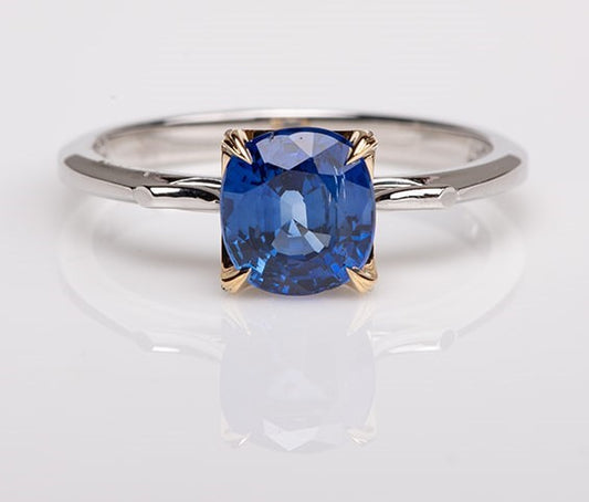blue sapphire set in gold with platinum shank ring