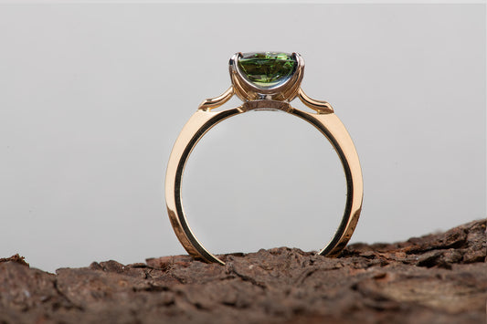 Single stone green sapphire ring