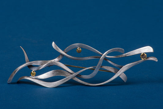 abstract brooch in sterling and gold with diamonds
