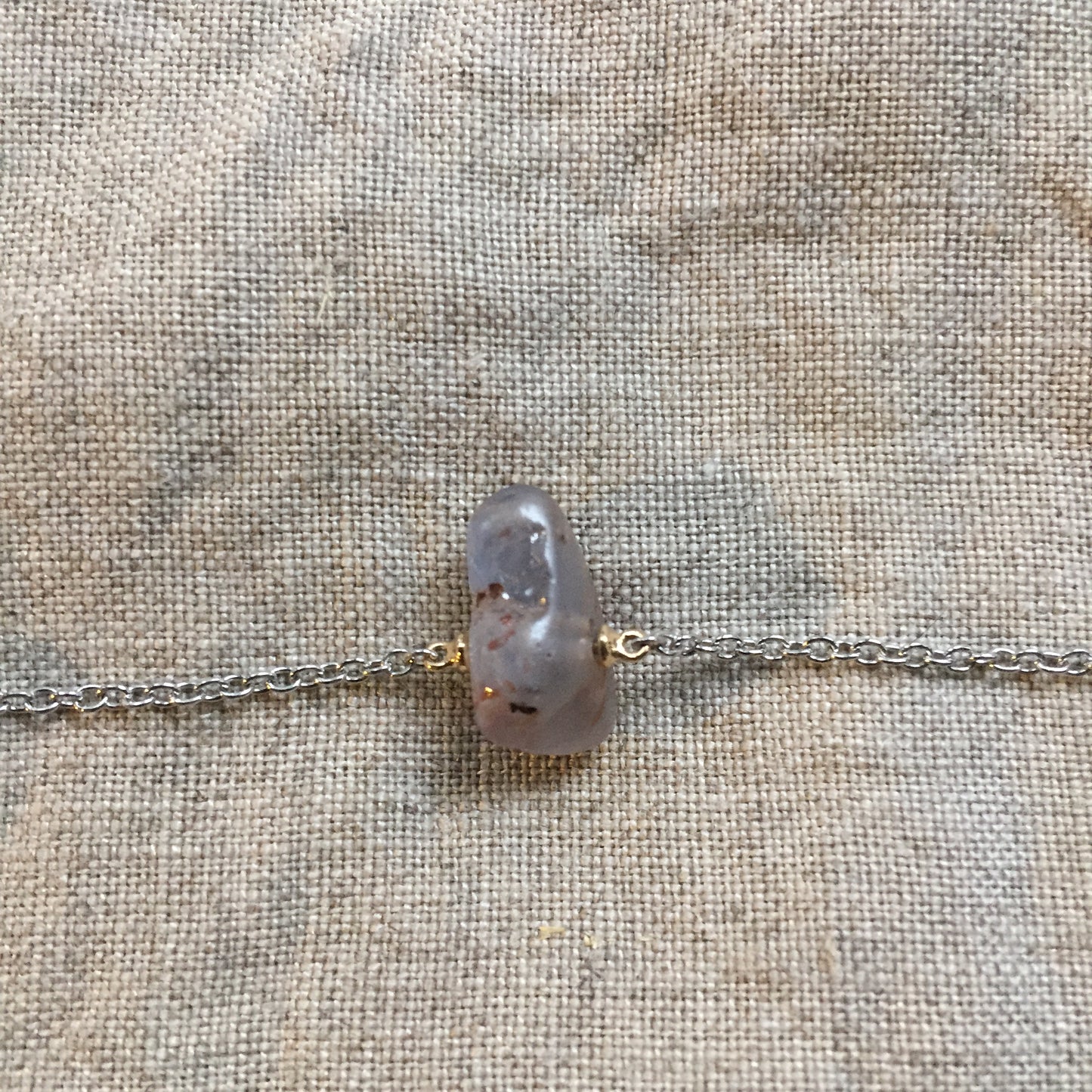 closeup of roman glass setting in necklace
