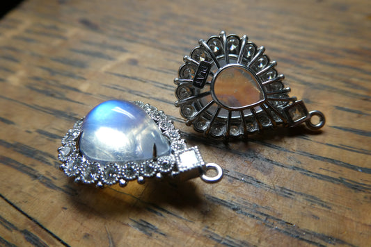 moonstone earrings set with diamonds in platinum