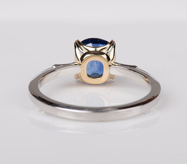 verso view of blue sapphire set in gold with platinum shank ring